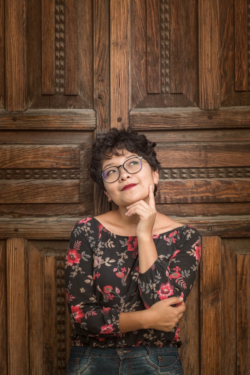 woman leaning against door while holding her cheek thinking about homeowners insurance in miami, florida